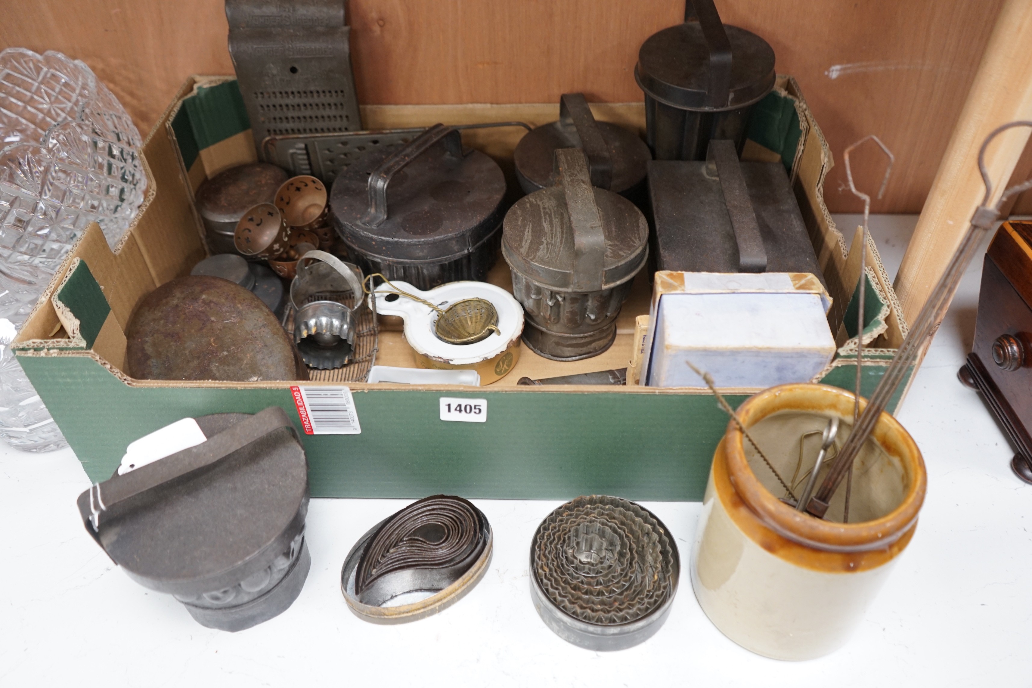 A good collection of tin plated iron jelly moulds, pastry moulds and kitchenalia